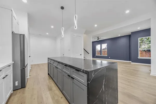 a kitchen with a stove and a sink