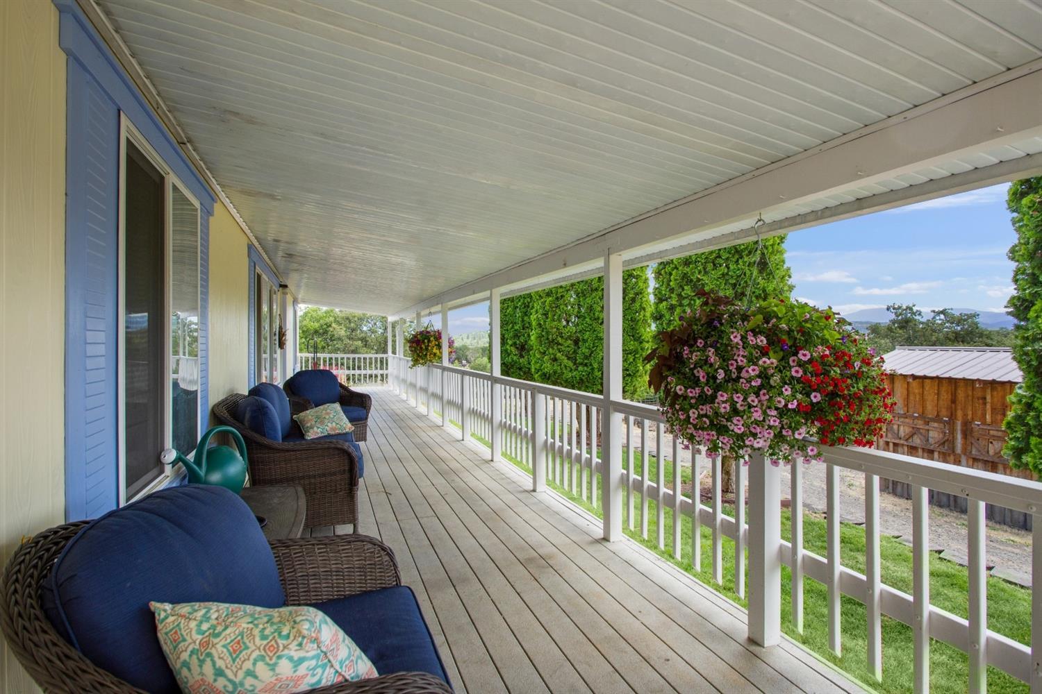 940 Ayres Road Eagle Point, OR 97524 - Photo 6 of 35 a balcony with furniture and wooden floor