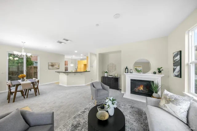 a view of a living room and dining room