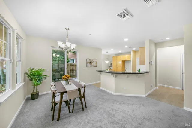 a front view of a house with a potted plant