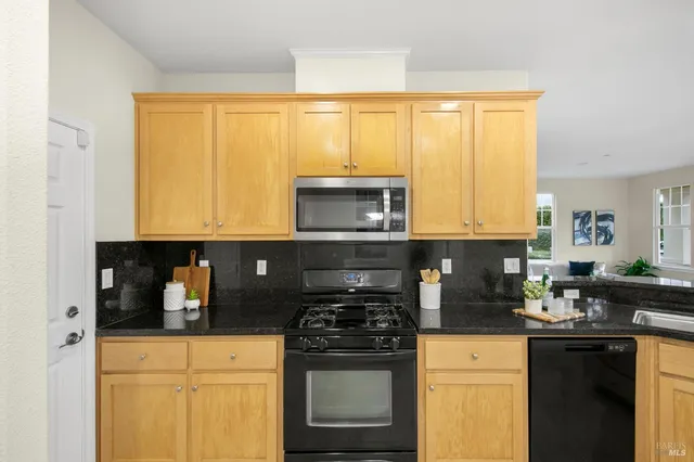 a view of a livingroom with furniture and a potted plant