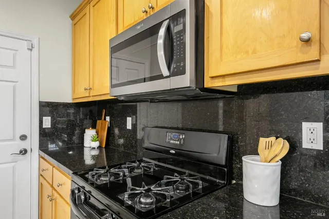a bedroom with a large bed and a potted plant