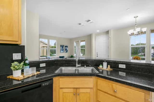 a bedroom with a bed and a potted plant