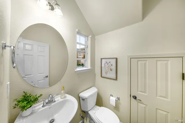 a bathroom with a sink double vanity and a mirror