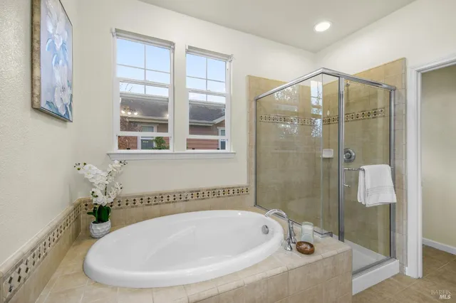 an aerial view of residential houses with yard