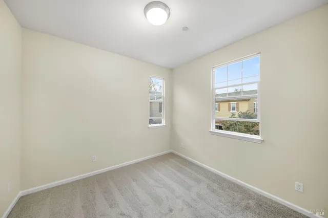 a picture of a room with a white wall and door