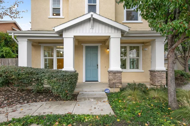 a view of a patio with couches and potted plants