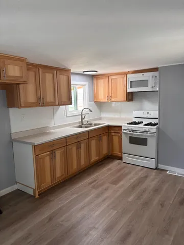 a kitchen with a stove and a sink