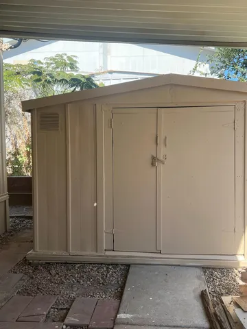 a view of a pathway besides a house