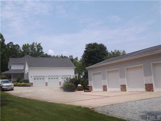 439 Whitt Town Road Roxboro, NC 27574 - Photo 8 of 25 View of 4 Bay Detached Garage/ Workshop and 3 Car Attached Garage.