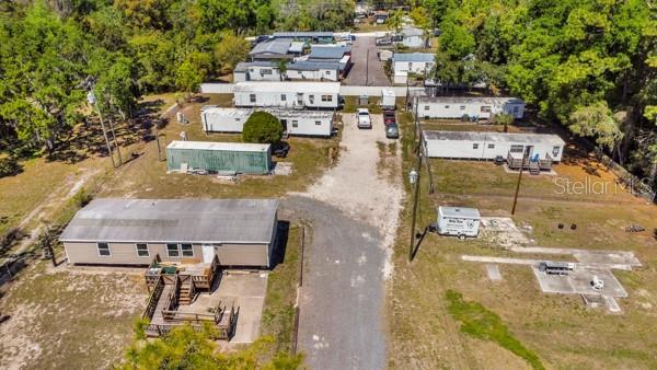 8325 Emmons Avenue New Port Richey, FL 34653 - Photo 2 of 15 an aerial view of residential houses with outdoor space