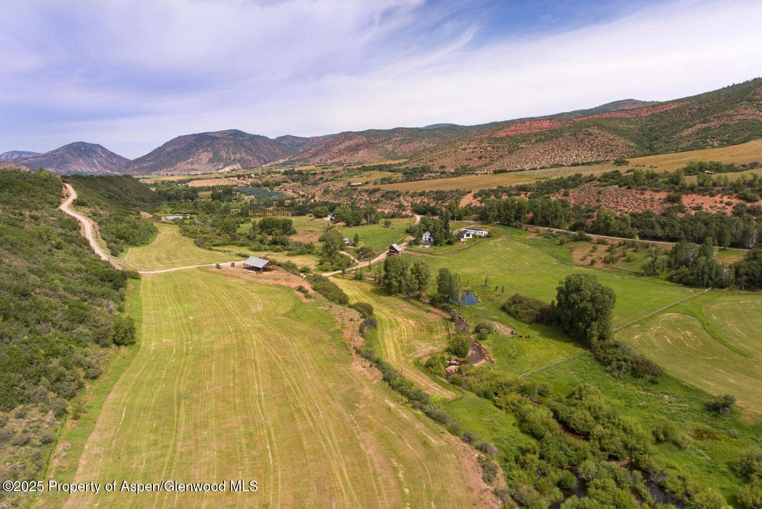1814 Woody Creek Road Aspen, CO 81612 - Photo 11 of 52 a view of an aerial view of residential houses with outdoor space and mountain view