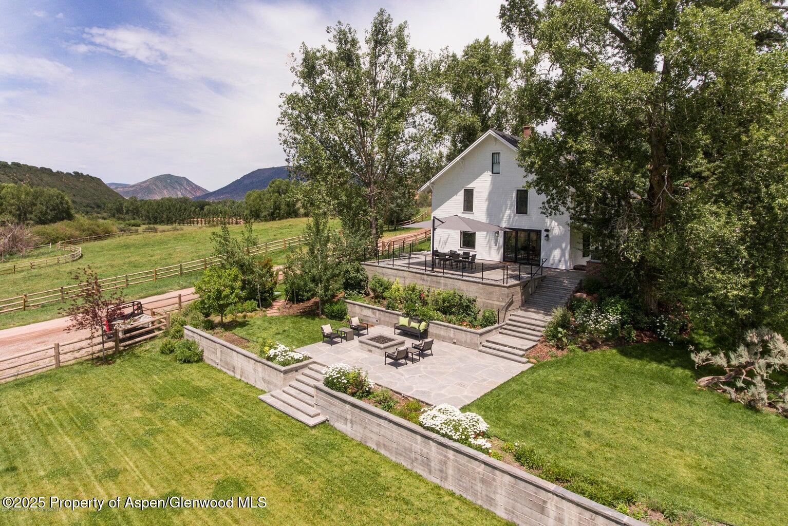 1814 Woody Creek Road Aspen, CO 81612 - Photo 12 of 52 an aerial view of a house with swimming pool garden and patio