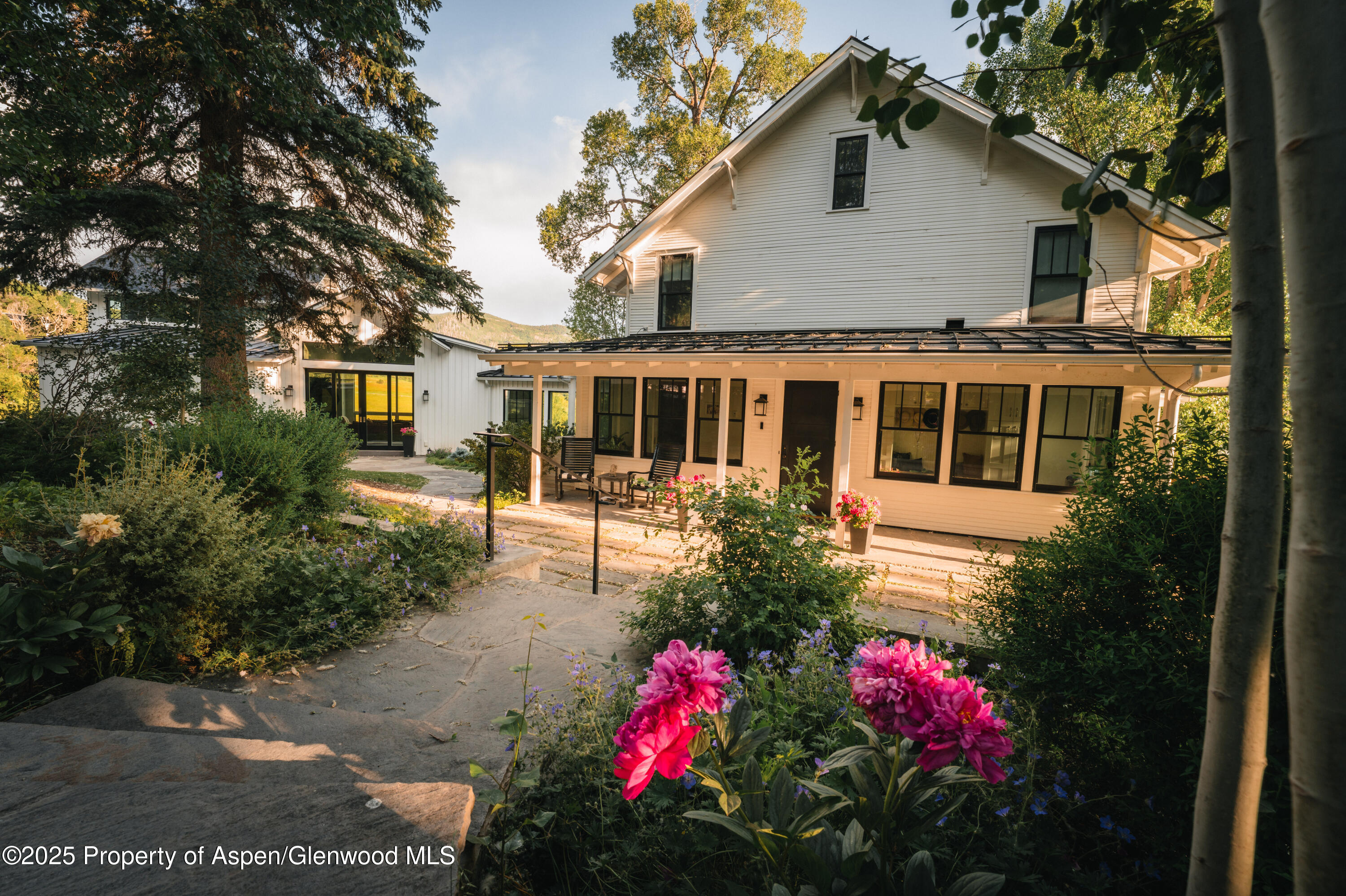 1814 Woody Creek Road Aspen, CO 81612 - Photo 2 of 52 a front view of a house with a yard