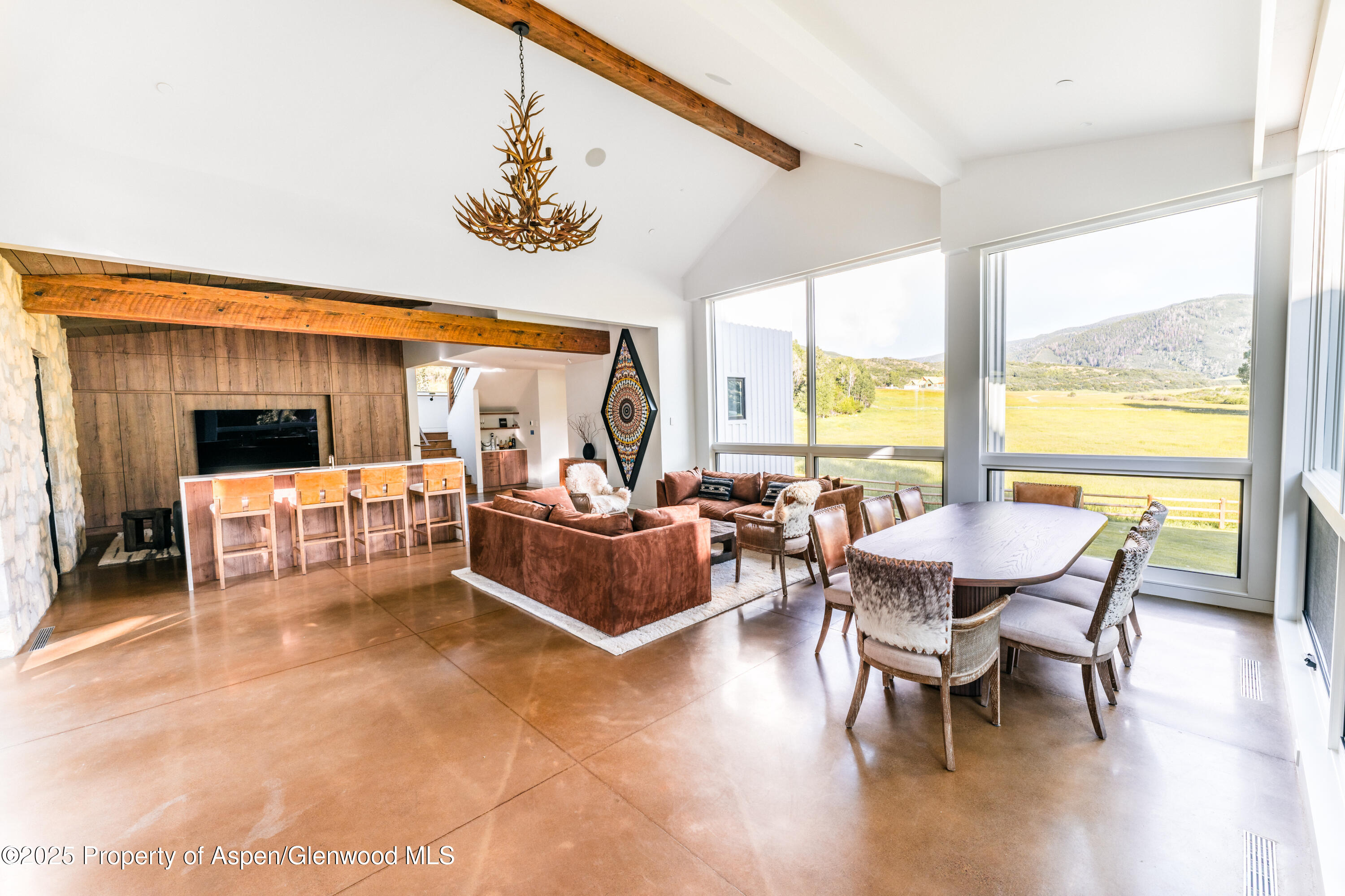 1814 Woody Creek Road Aspen, CO 81612 - Photo 21 of 52 a living room with furniture and a large window