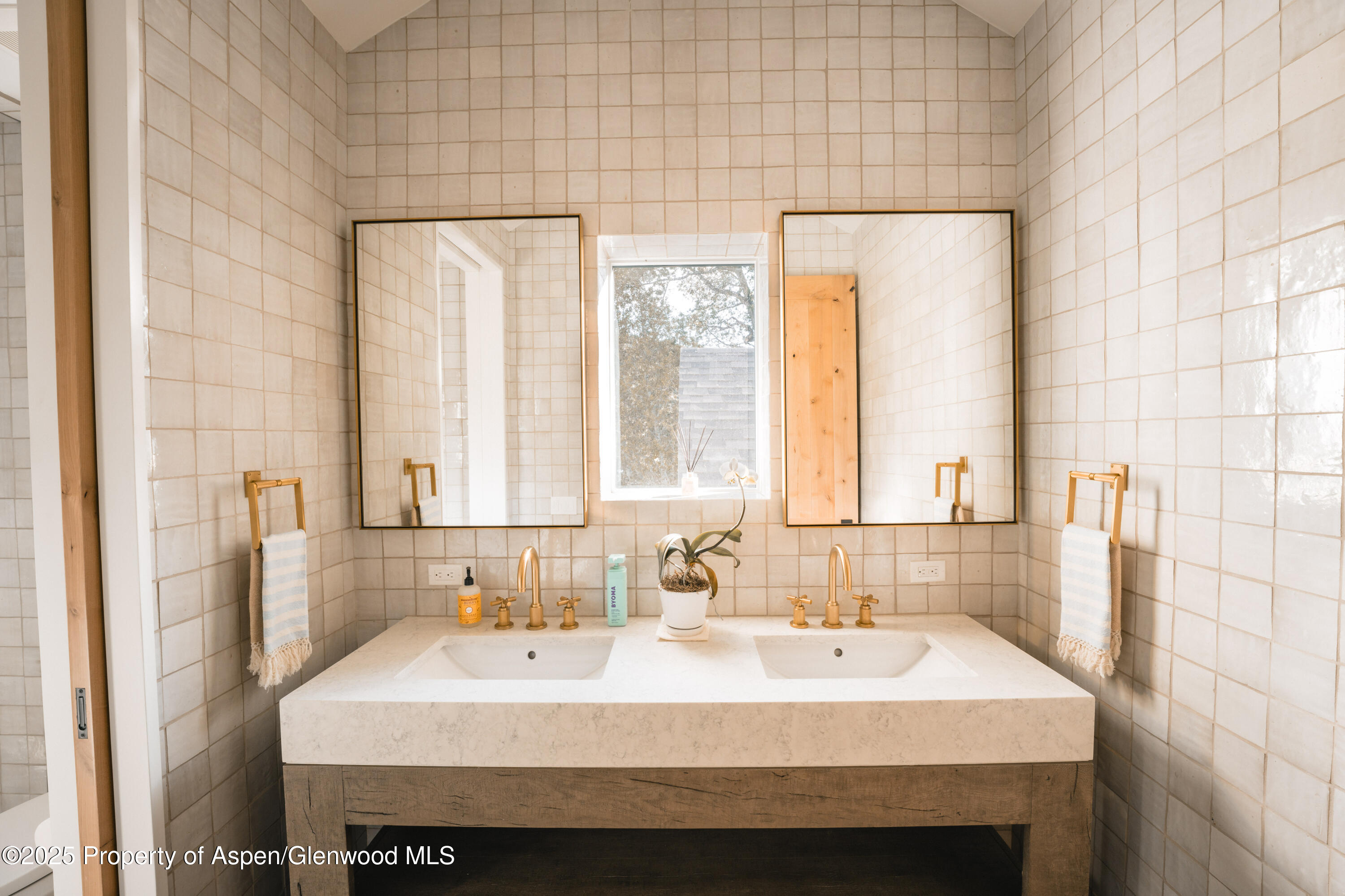 1814 Woody Creek Road Aspen, CO 81612 - Photo 28 of 52 a bathroom with a sink and a bathtub