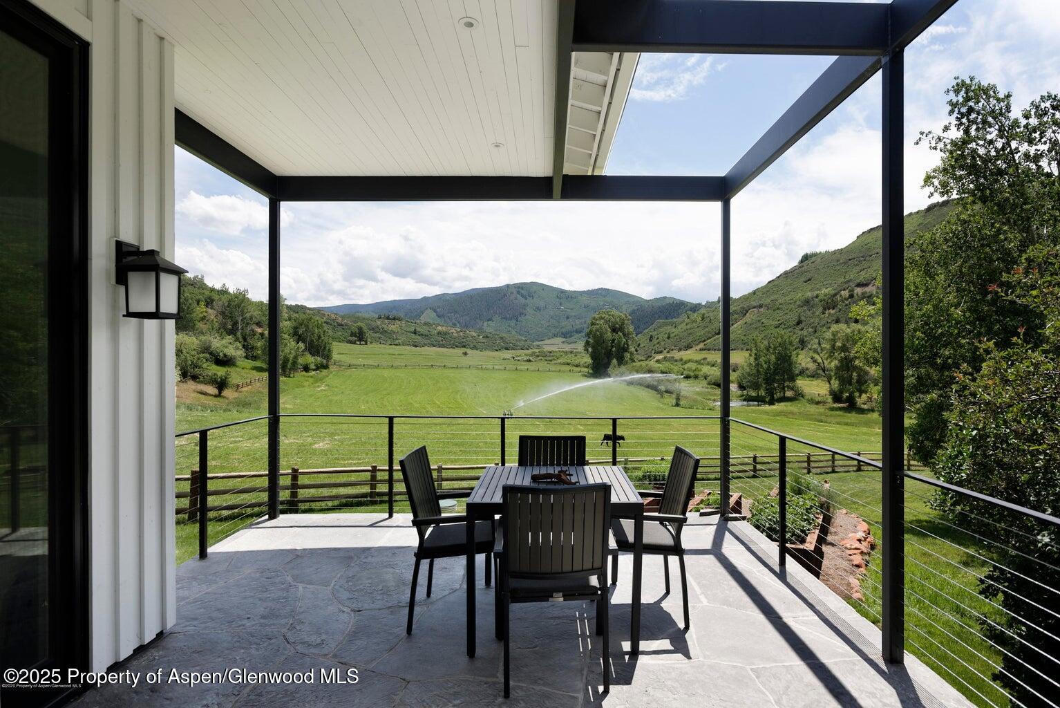 1814 Woody Creek Road Aspen, CO 81612 - Photo 40 of 52 a view of a chairs and table in the balcony