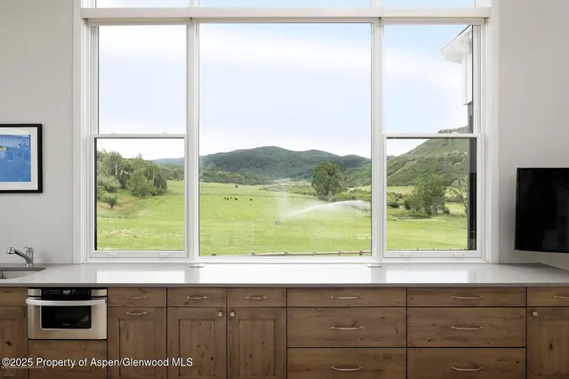a view of a dining room with furniture window and outside view
