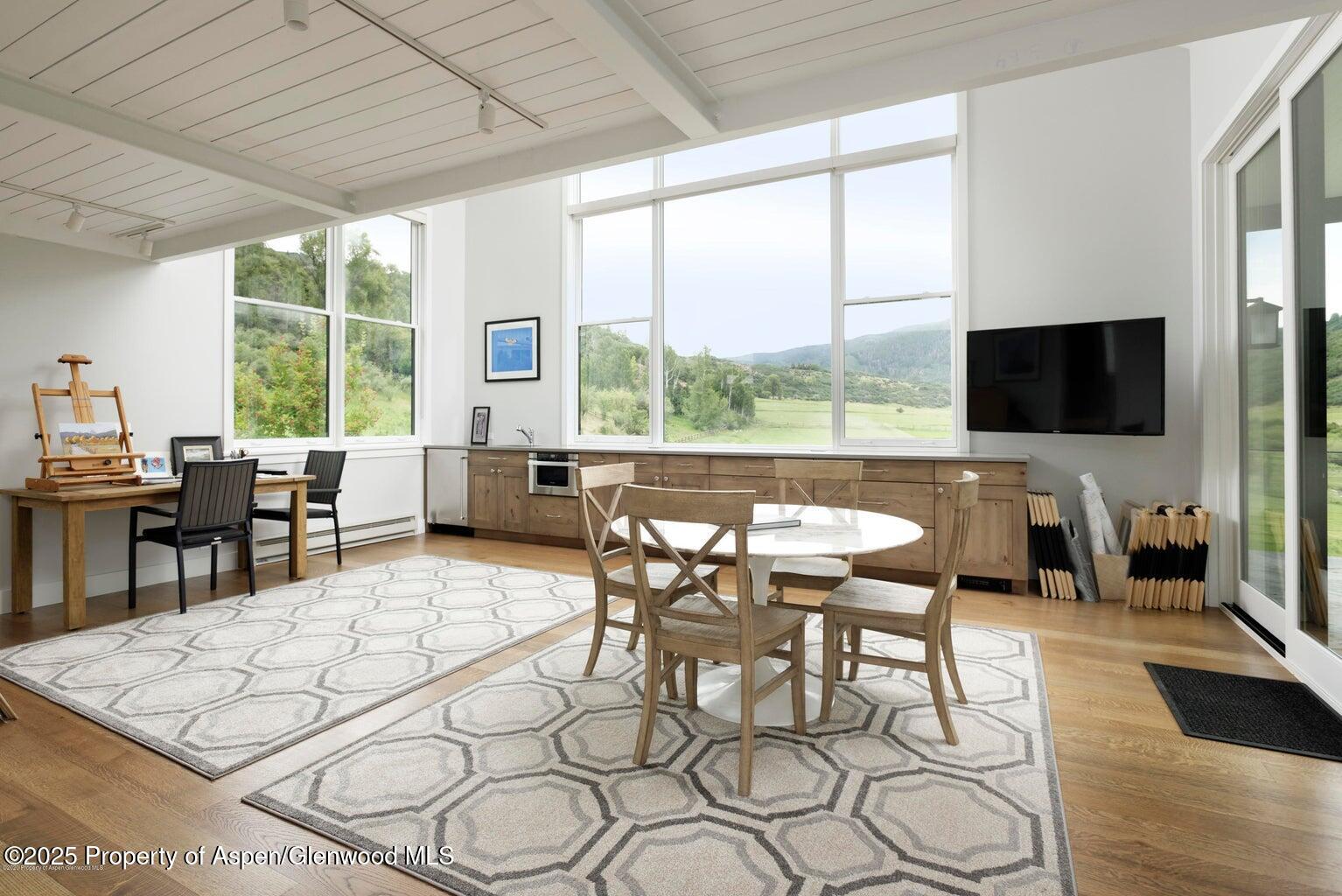 1814 Woody Creek Road Aspen, CO 81612 - Photo 42 of 52 a view of a dining room with furniture window and outside view
