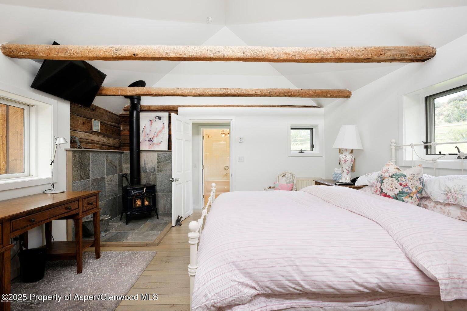 1814 Woody Creek Road Aspen, CO 81612 - Photo 52 of 52 a bedroom with a bed and a window