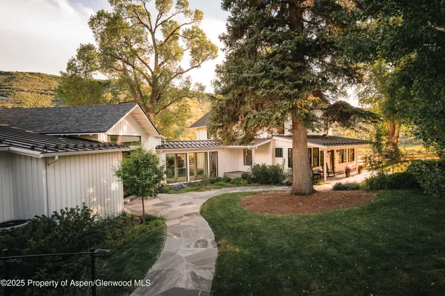 a view of a grassy area with an trees