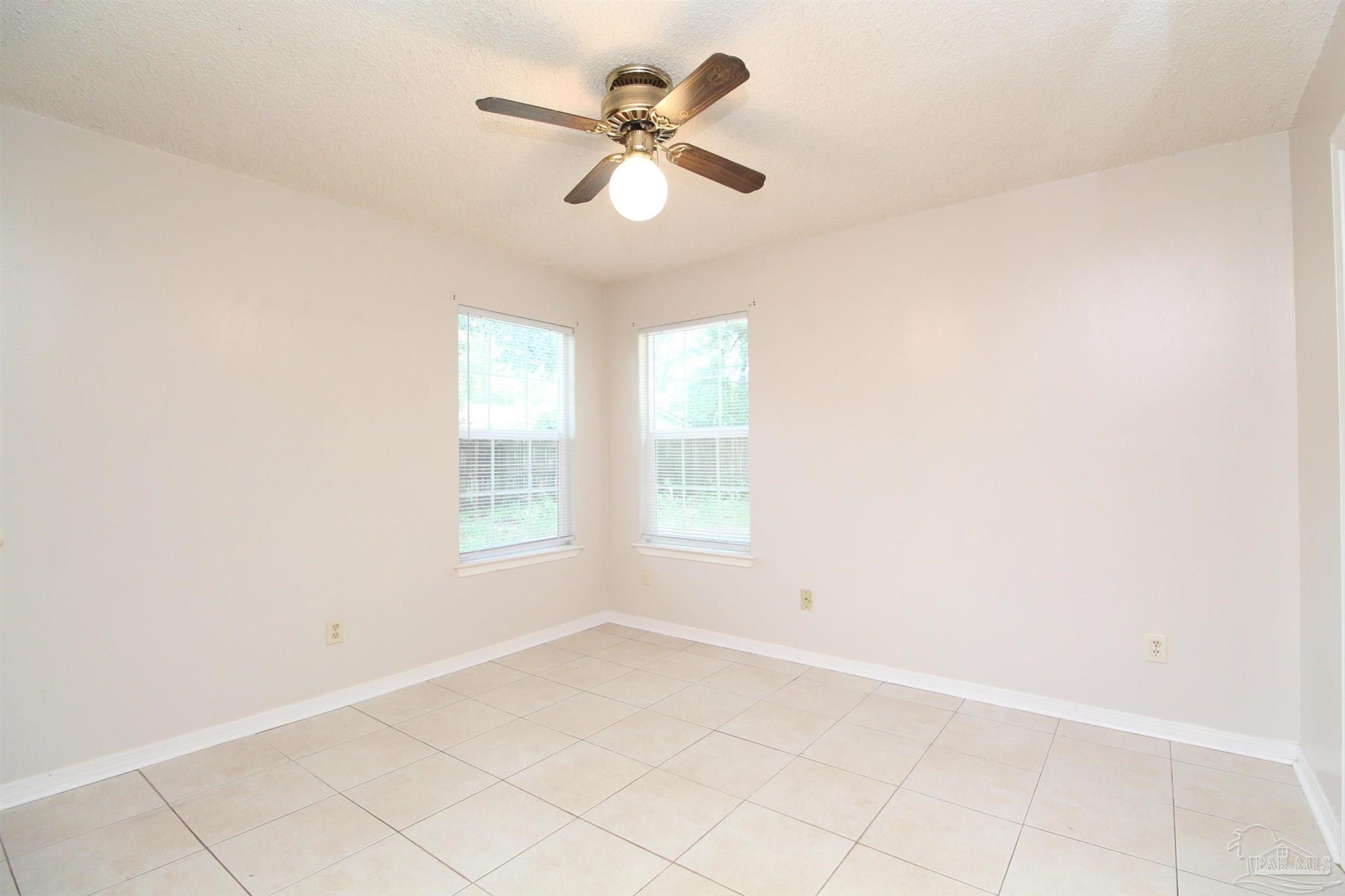 6528 Hunter Street Milton, FL 32570 - Photo 14 of 17 a view of an empty room with a window