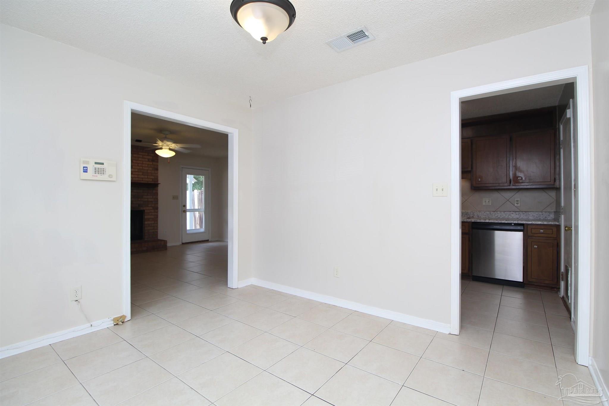 6528 Hunter Street Milton, FL 32570 - Photo 7 of 17 a view of a kitchen cabinets and a room