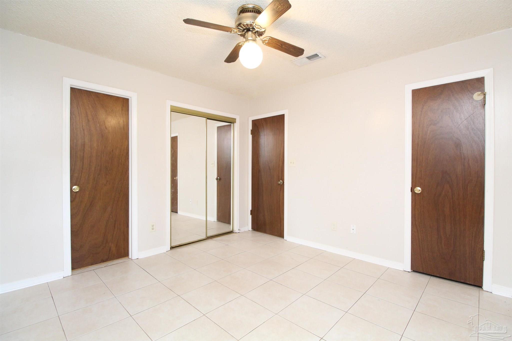 6528 Hunter Street Milton, FL 32570 - Photo 8 of 17 a view of empty room with a ceiling fan