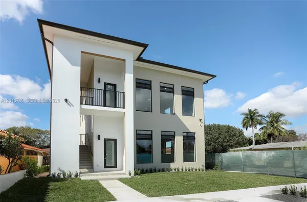 front view of a house with a yard