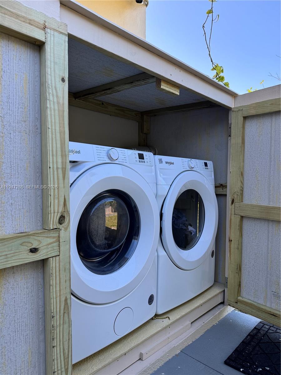883 Southwest 10th Street, Unit 1 Pompano Beach, FL 33060 - Photo 20 of 20 a utility room with dryer and washer