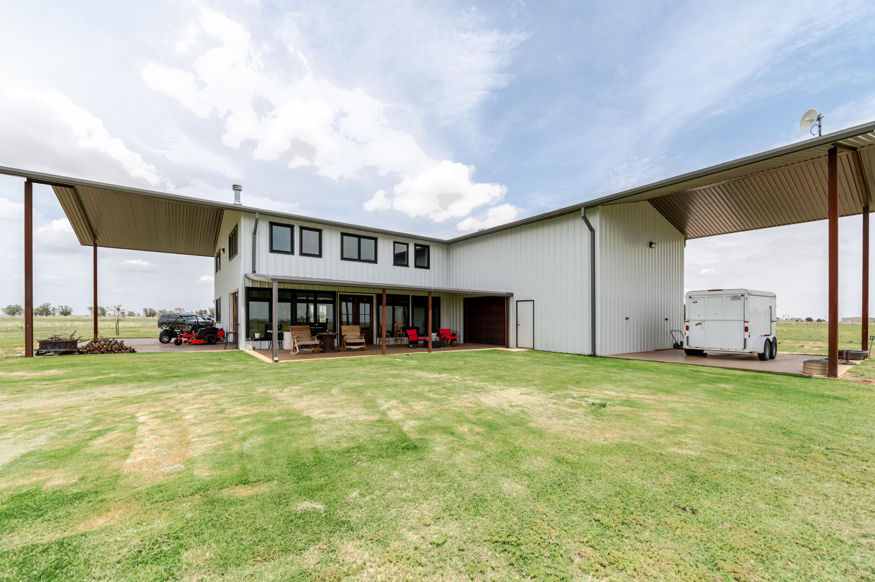 6792 Maine Road Anton, TX 79313 - Photo 57 of 77 a view of a big house next to a big yard