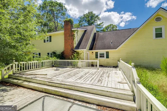 a view of backyard with deck