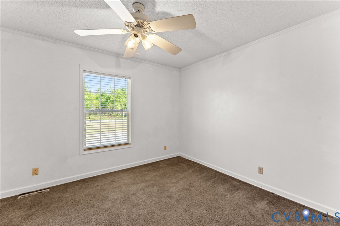 1450 Mt Prospect Road Laneview, VA 22504 - Photo 15 of 25 2nd Bedroom with wall to wall carpet & fan.