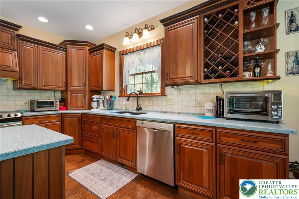 1222 Spring Road Andreas, PA 18211 - Photo 6 of 44 Rich wood cabinetry and hardwood
flooring define this functional,
well-appointed cooking space.