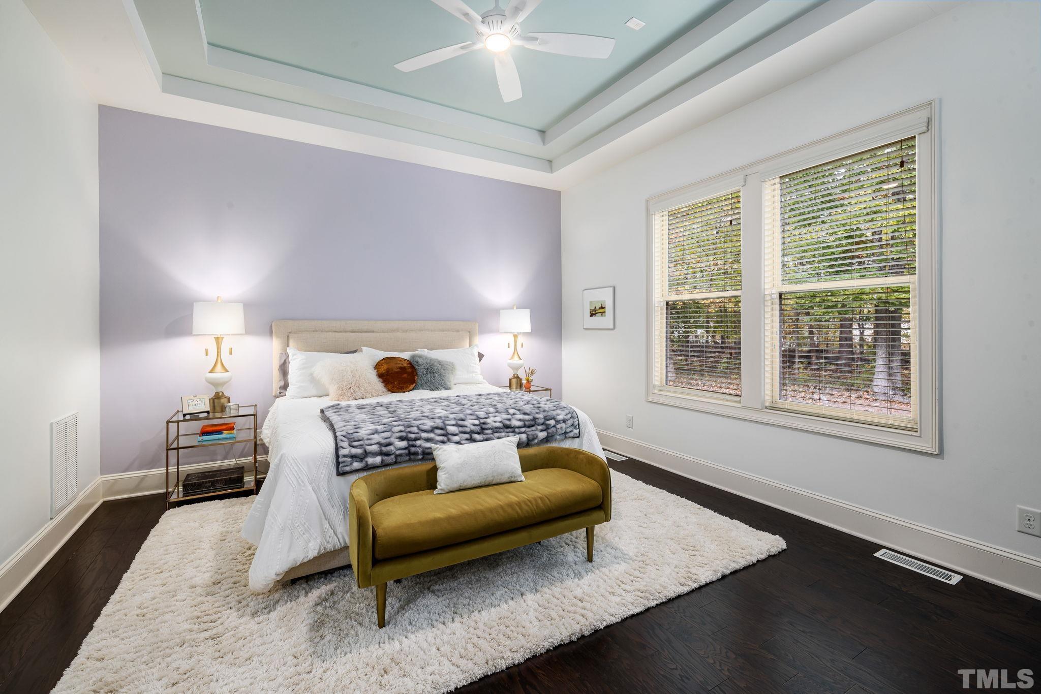 4526 Farrington Road Durham, NC 27707 - Photo 20 of 42 a bedroom with a bed a chandelier and window