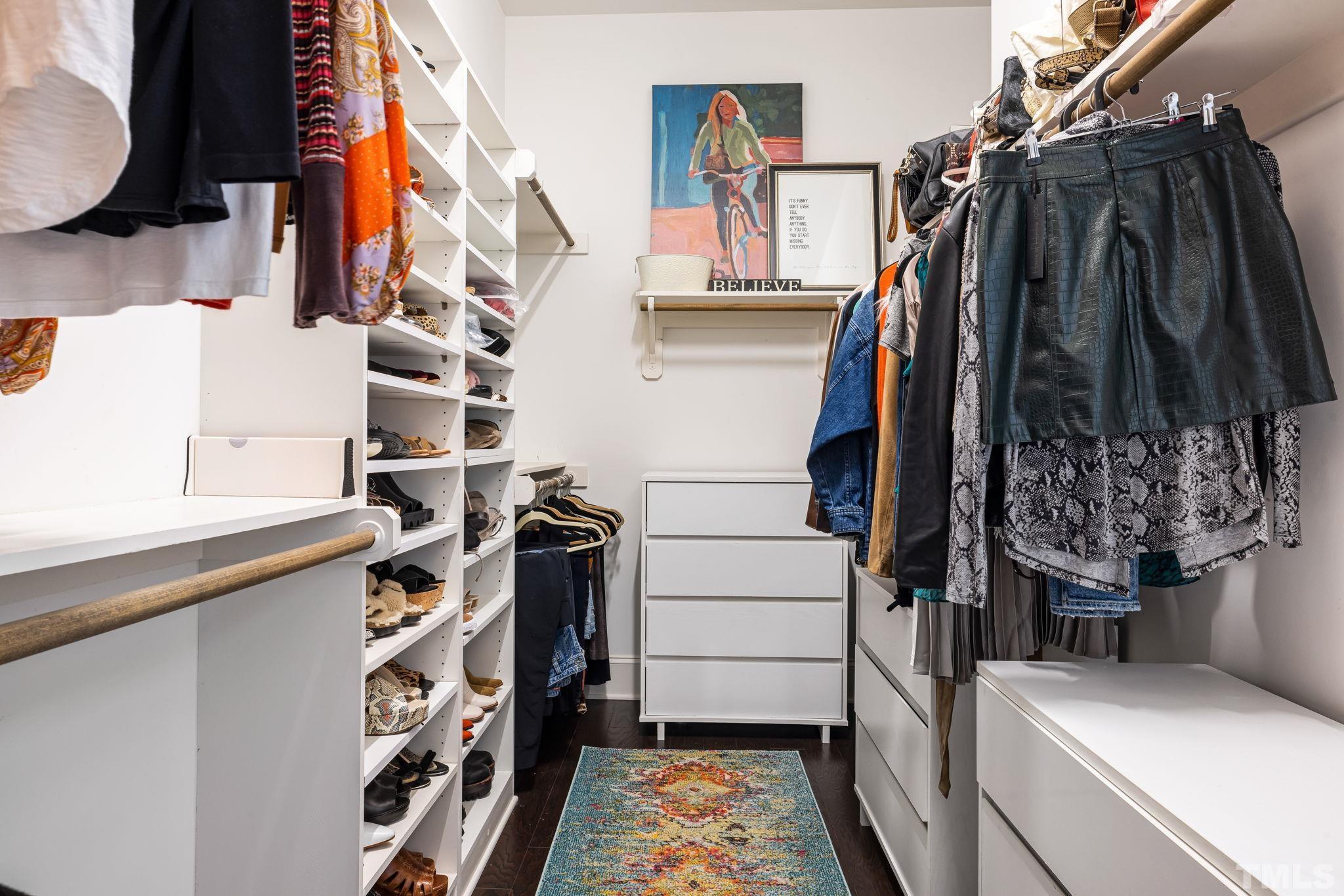 4526 Farrington Road Durham, NC 27707 - Photo 27 of 42 a view of walk in closet with clothes and shoes