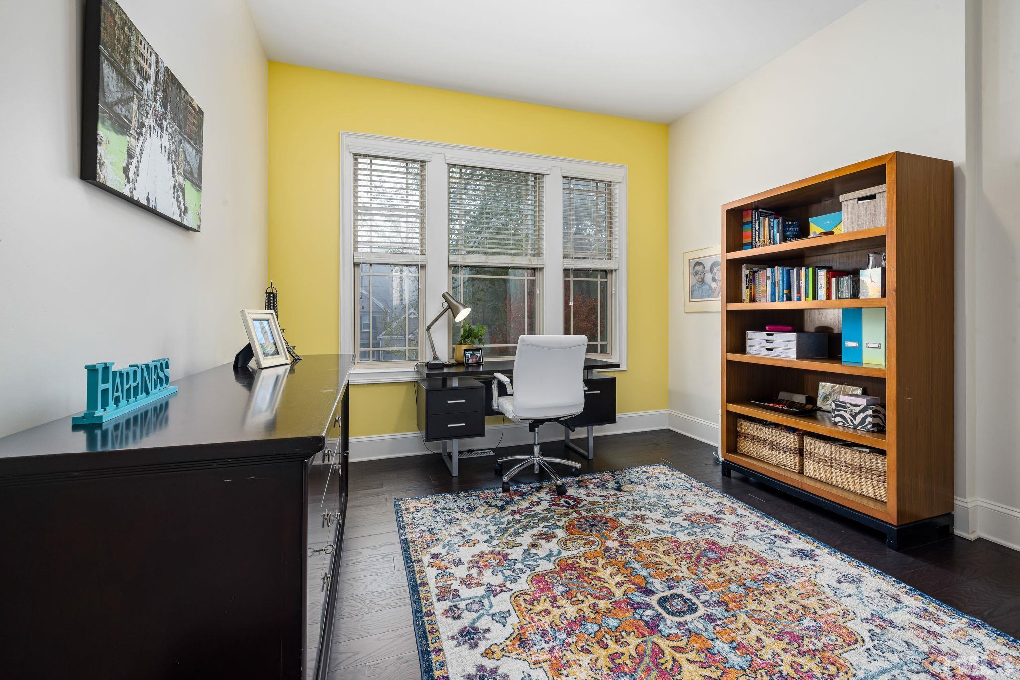 4526 Farrington Road Durham, NC 27707 - Photo 28 of 42 a workspace with furniture and a bookshelf