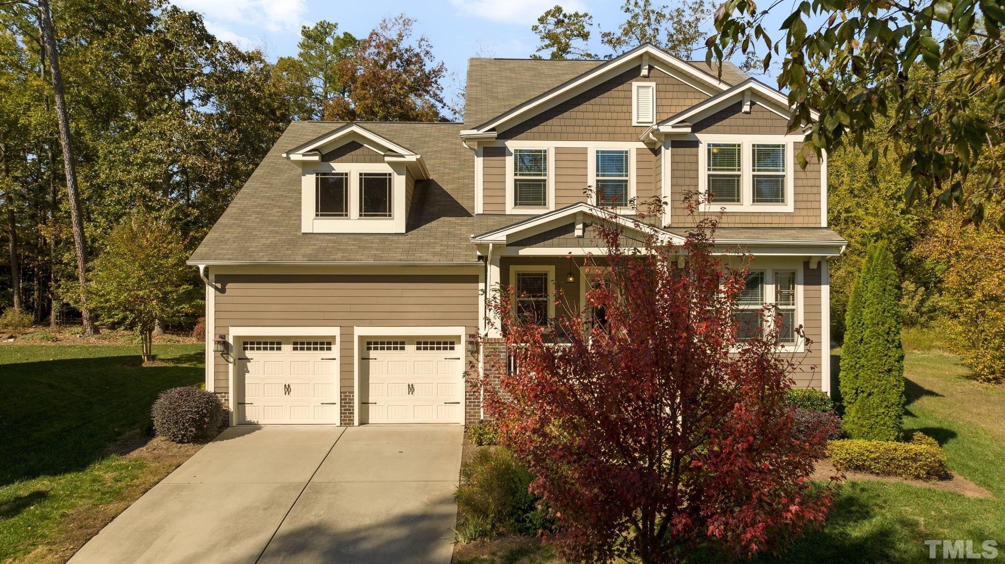 4526 Farrington Road Durham, NC 27707 - Photo 3 of 42 a front view of a house with garden