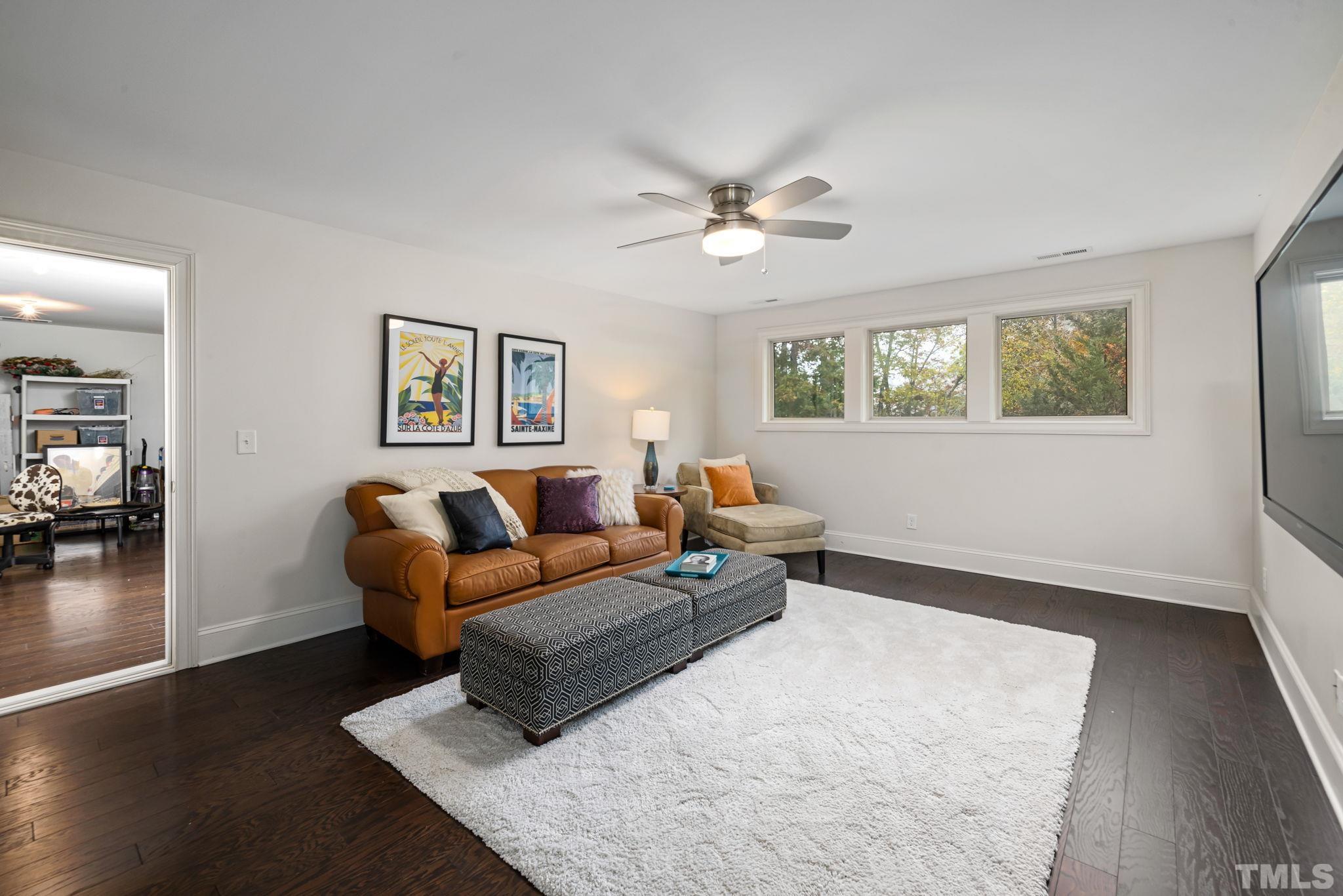 4526 Farrington Road Durham, NC 27707 - Photo 34 of 42 a living room with furniture wooden floor and a window