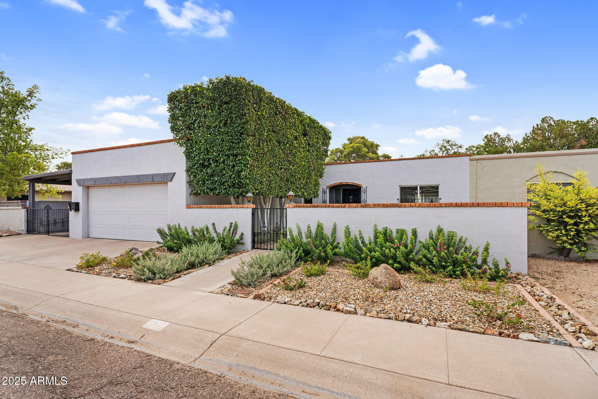 1515 West Palmaire Avenue Phoenix, AZ 85021 - Photo 1 of 23 a front view of a house with garden