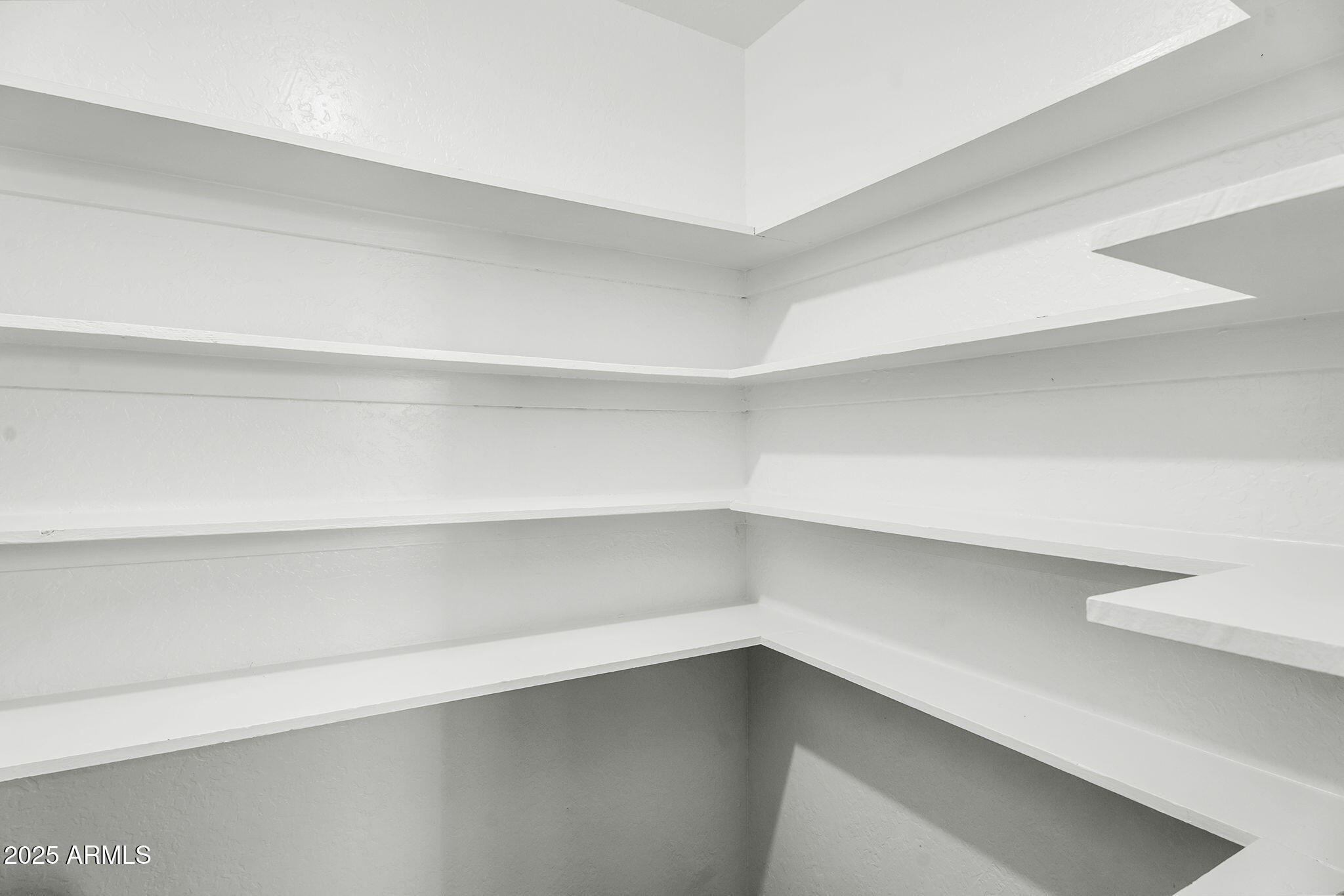 1515 West Palmaire Avenue Phoenix, AZ 85021 - Photo 10 of 23 a storage room with empty racks