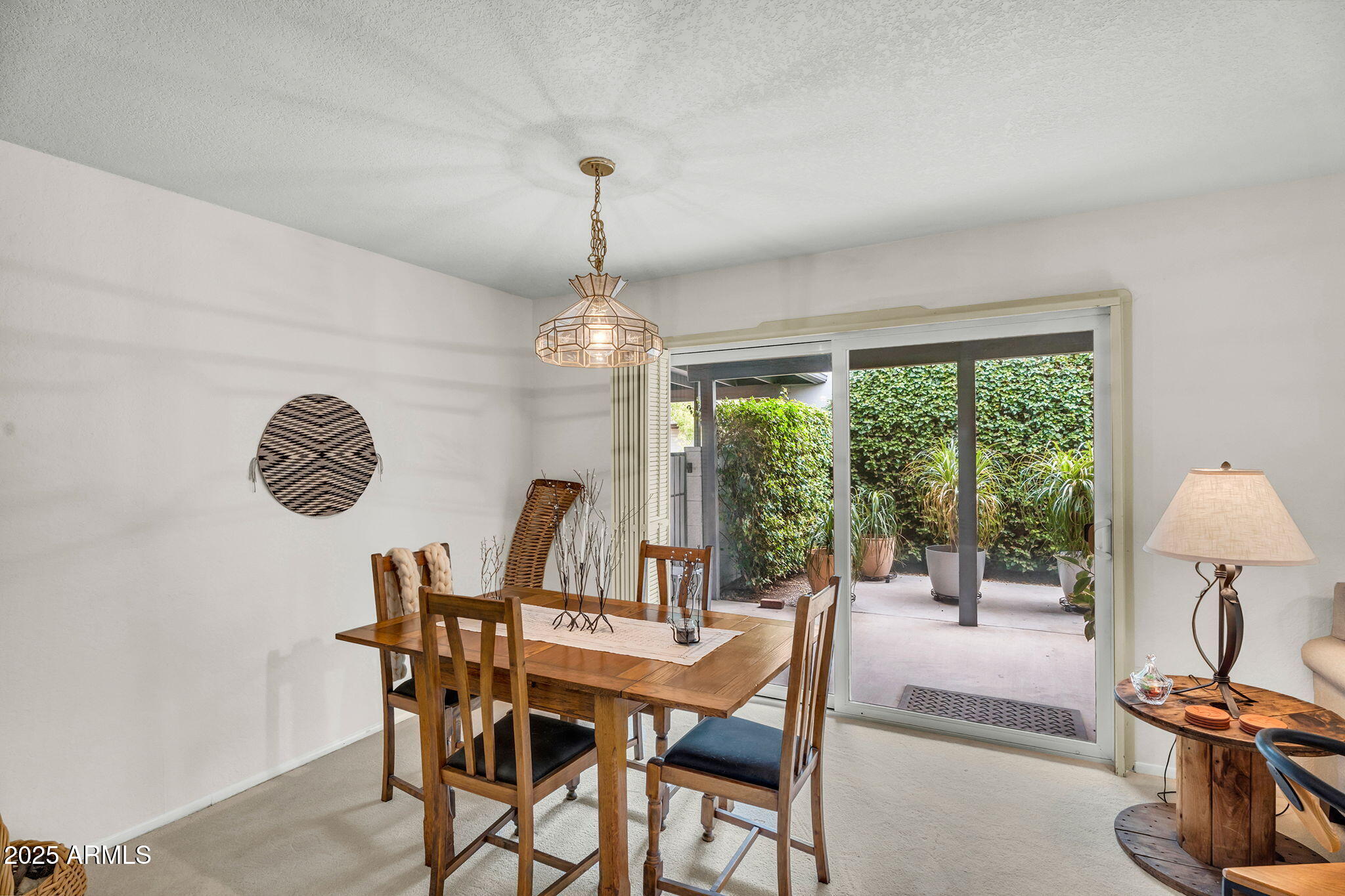 1515 West Palmaire Avenue Phoenix, AZ 85021 - Photo 11 of 23 a view of a dining room with furniture a chandelier and wooden floor