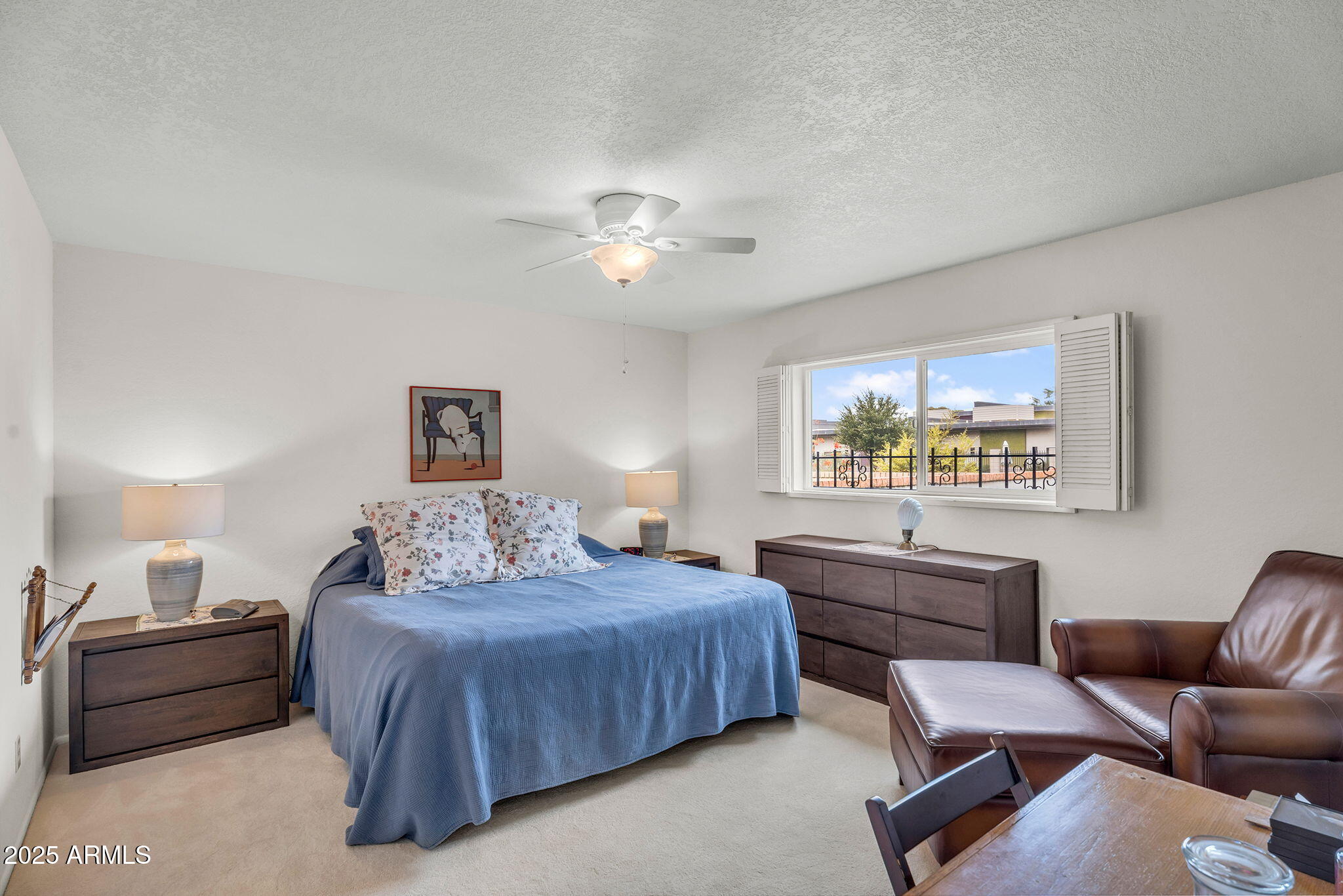 1515 West Palmaire Avenue Phoenix, AZ 85021 - Photo 12 of 23 a bedroom with a bed and a chandelier