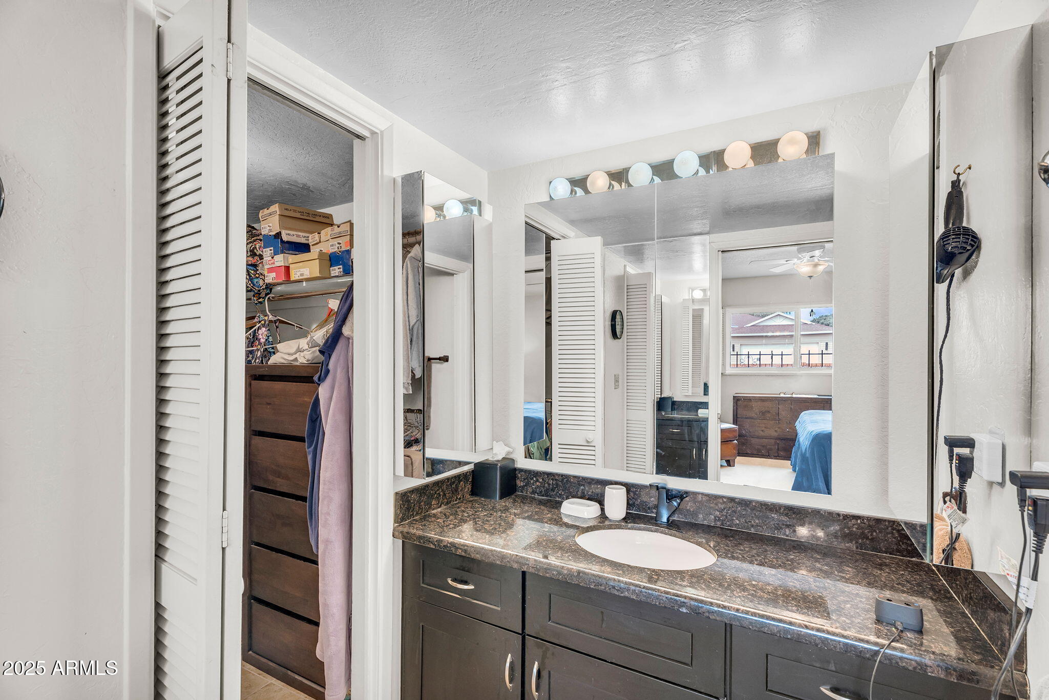 1515 West Palmaire Avenue Phoenix, AZ 85021 - Photo 13 of 23 a bathroom with a granite countertop sink and a mirror