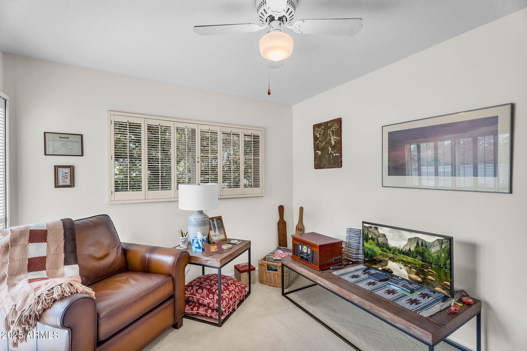 1515 West Palmaire Avenue Phoenix, AZ 85021 - Photo 14 of 23 a living room with furniture a flat screen tv and a window