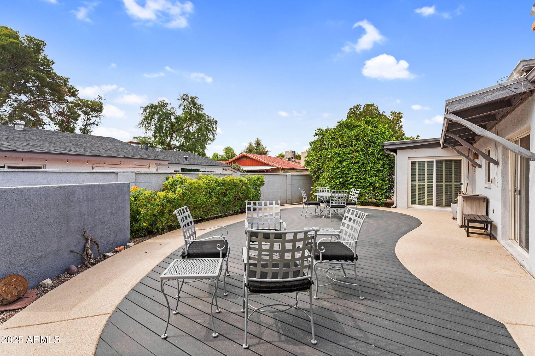1515 West Palmaire Avenue Phoenix, AZ 85021 - Photo 19 of 23 a view of a patio with couches table and chairs and potted plants