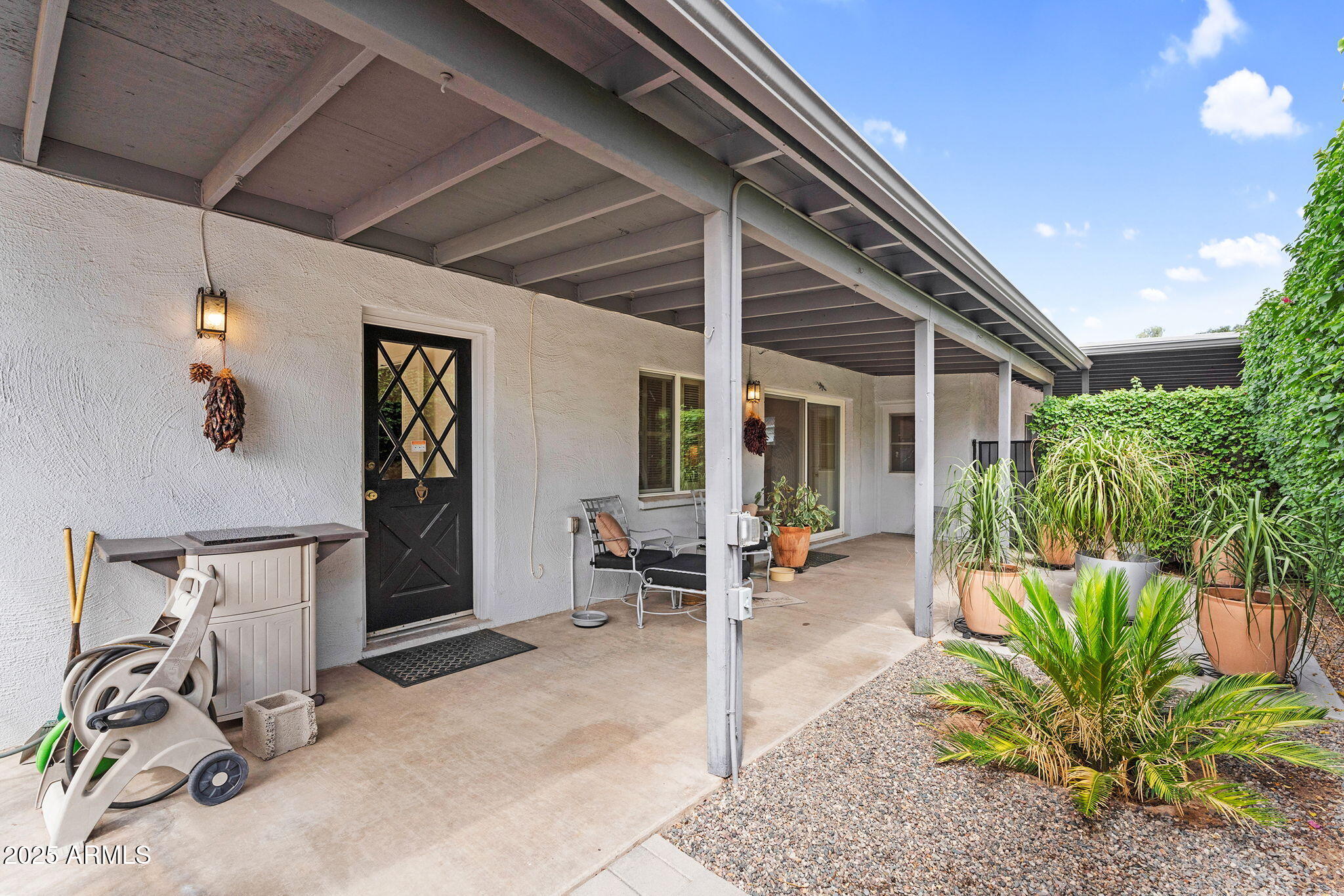 1515 West Palmaire Avenue Phoenix, AZ 85021 - Photo 22 of 23 a building outdoor space with patio furniture and potted plants
