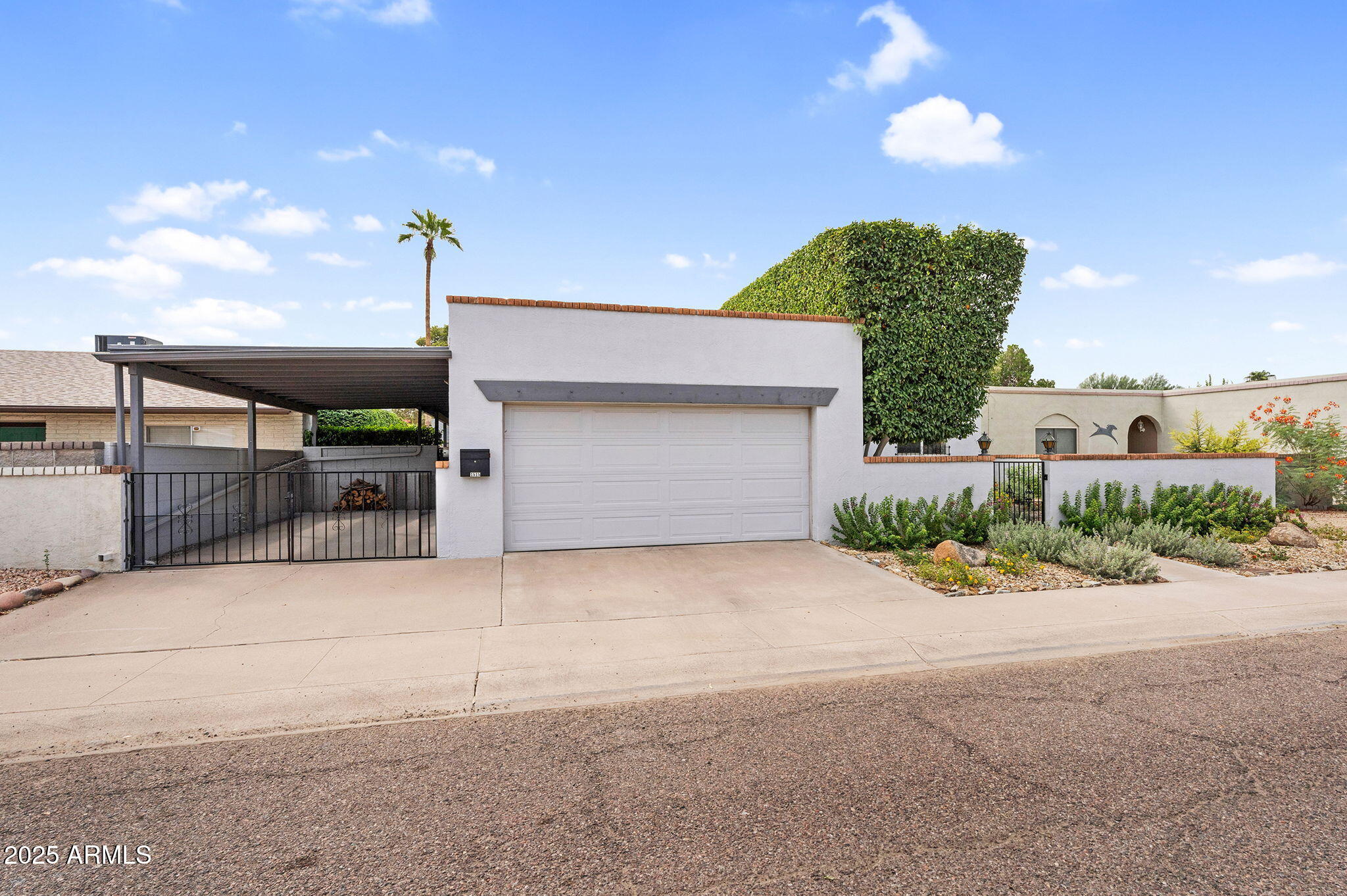 1515 West Palmaire Avenue Phoenix, AZ 85021 - Photo 6 of 23 a front view of a house with a yard and garage