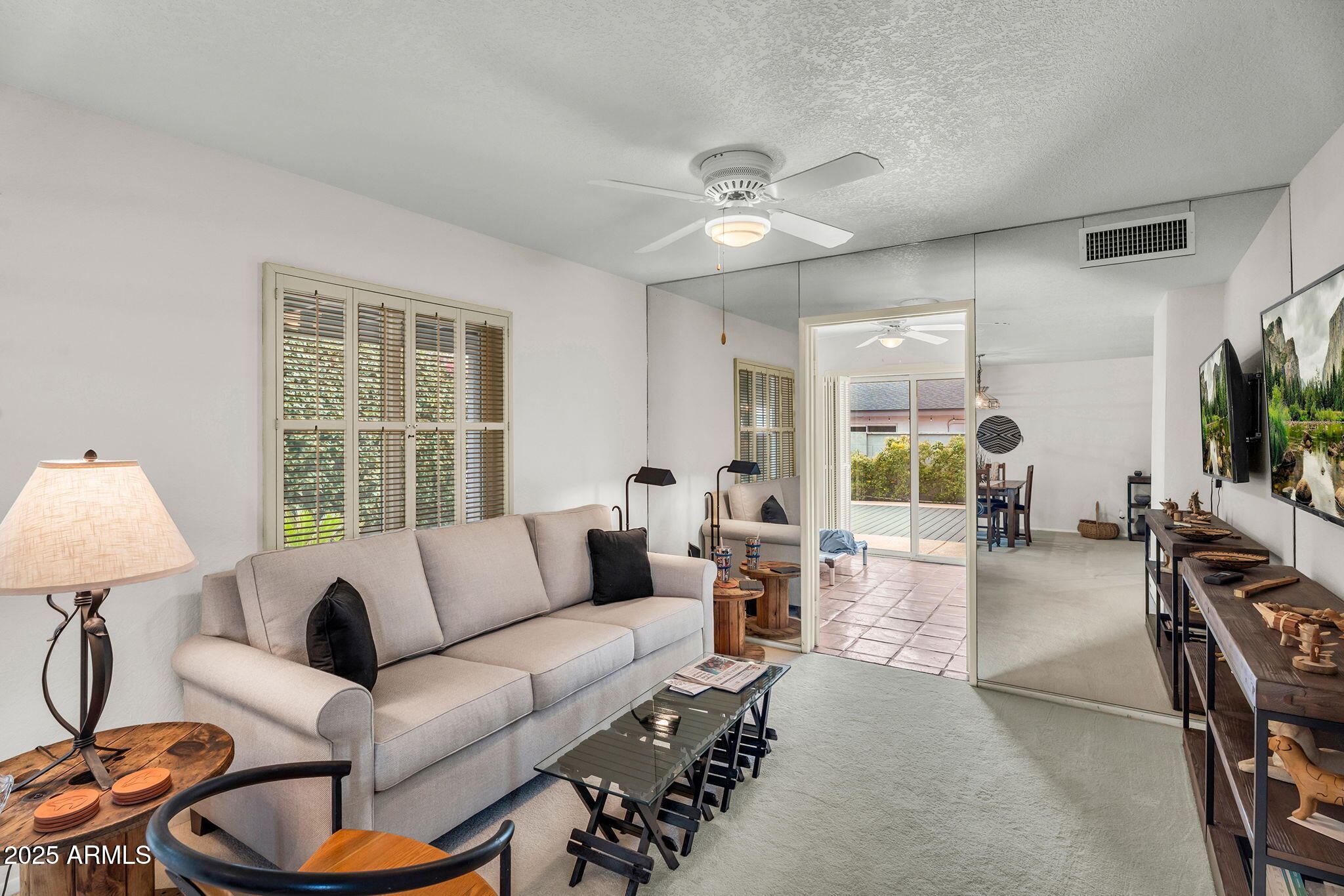 1515 West Palmaire Avenue Phoenix, AZ 85021 - Photo 8 of 23 a living room with furniture a chandelier and a window