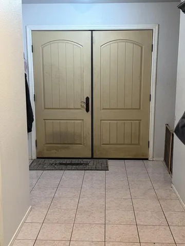 a bathroom with a glass shower door and a shower